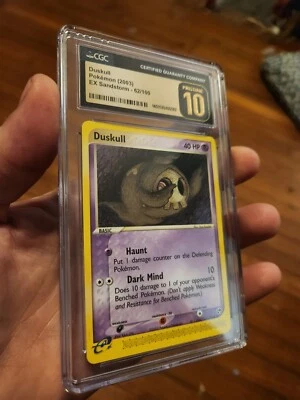 (POP 4) CGC 10 PRISTINE Duskull 62/100 EX Sandstorm 2003 Pokemon Card - Image 1 of 4