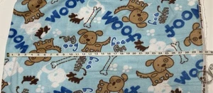 NEW Fleece fabric by the yard -Dogs Bones Paw Prints “Woof” - on Blue Background - Picture 1 of 2