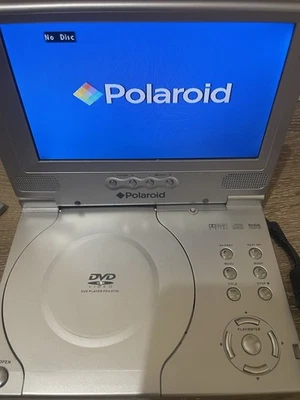 Reproductor de DVD portátil plateado vintage Polaroid PDV-0713b 7" películas de pantalla ancha para automóvil Foto 1 de 4