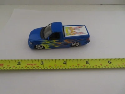 Hot Wheels Oil Can Ford F-150 Lightning Blue w/Flames Loose - Image 1 of 4