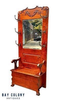 ANTIQUE VICTORIAN TIGER OAK HALL TREE WITH RIBBON CARVED CREST & BEVELED MIRROR - Image 1 of 4