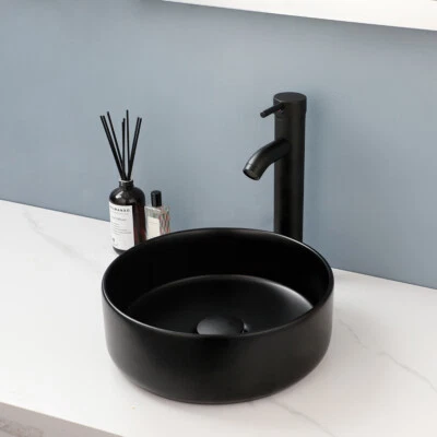 Juego de grifos mezcladores montados en cubierta para lavabo de cerámica redondo para lavabo de baño negro Foto 1 de 4