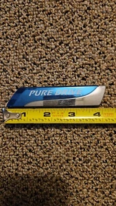 OEM Nissan “Pure Drive” Emblem Badge Logo BG00A ABS 2 - Foto 1 di 2