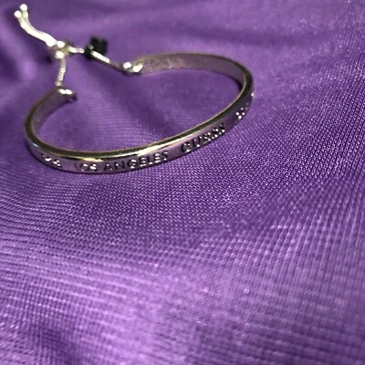 BRAZALETE AJUSTABLE TONO PLATA ADIVINAR LOGO Foto 1 de 4