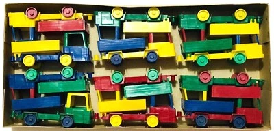 VINTAGE 1970s PLASTIC DUMP TRUCKS GREEK PENNY TOYS DOZEN NEW IN FACTORY BOX RARE - Image 1 of 4