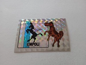 FIGURINA CALCIATORI EDIS 1985/86 SCUDETTO EMPOLI n 55/A NUOVA CON VELINA - Imagen 1 de 2