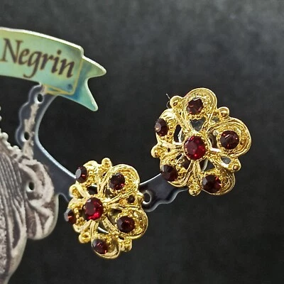 Pendientes con flores Michal Negrin poste grande chapados en oro y cristales de Swarovski granates Foto 1 de 4