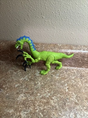 Juguete para niños dinosaurio verde con luces garras de sonido  Foto 1 de 4