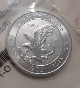 EAGLE 1/2 OZ SILVER 99.99 FINE - STILL IN APMEX WRAP - Picture 1 of 6