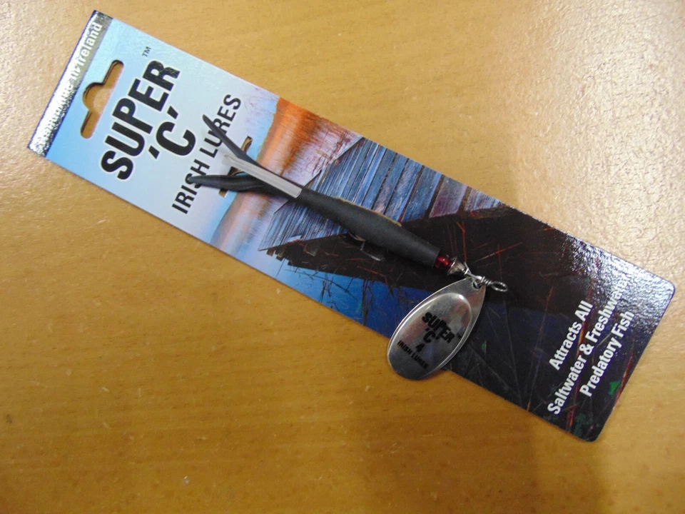 Flying C, schwarzer Gummi mit kupferfarbener Klinge, Lachsspinnköder 23g - Bild 1 von 1