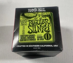 2221 Ernie Ball Regular Slinky Nickel 10-46 Corde per chitarra elettrica 12 SET - Foto 1 di 7