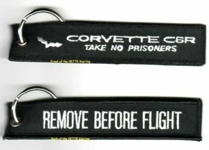 JUEGO DE 2 LLAVES DE COCHE DE CARRERAS CORVETTE: QUITAR ANTES DEL VUELO - NO TOMAR PRISIONERO - Imagen 1 de 5