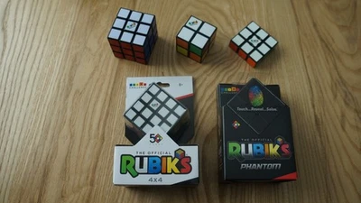 Lot of 2 New Sealed Rubik's Phantom 3x3 & 4x4 Cube + 2x2 + 1x3 + 3x3 = 5 Items - Image 1 of 4