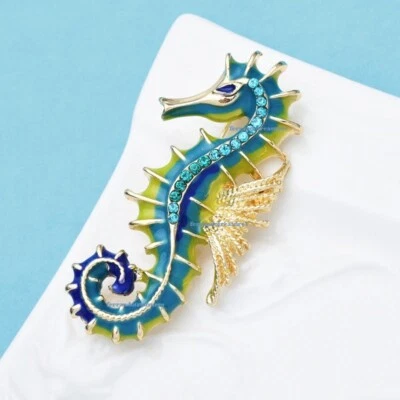 Broche prendedor azul verde dorado caballito de mar cristal estrás con bolsa de tela de lámina dorada Foto 1 de 4