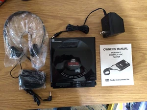 Nuovo SII Seiko Instruments Lettore CD Portatile PHX50CD Adattatore AC Cuffie Funzionante - Foto 1 di 5