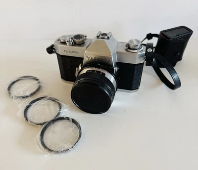 Cámara fotográfica SLR Yashica TL-Super 35 mm con filtros de correa de lente de 50 mm y estuche de cuero Foto 1 de 4