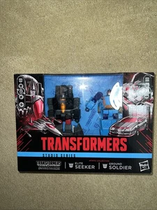 Transformers Studio Series Figure Deluxe Class - Elite Seeker & Ground Soldier - Picture 1 of 4