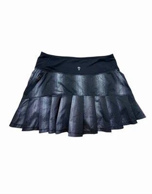 Falda metálica plisada Ivivva by Lululemon negra a rayas niñas talla 12 Foto 1 de 4