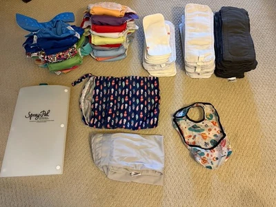 Paquete de pañales de tela - 19 pañales + 45 insertos + protector contra aerosol + 2 bolsas húmedas Foto 1 de 4