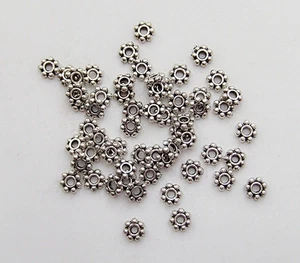 50pz perline metallo fiore spacer separatori 6mm colore argento tibet - Foto 1 di 1