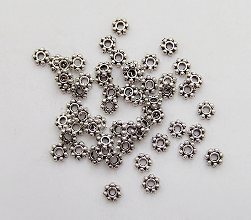 50pz  perline metallo fiore spacer separatori  6mm colore argento tibet - Immagine 1 di 1