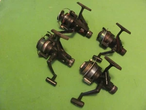 4 Vintage Spinnrollen - FINTEX CM2, ZEBCO ZX20, DAIWA M1350, QUANTEN QG20. - Bild 1 von 5