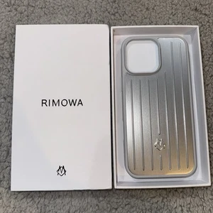 RIMOWA Coque Aluminium pour iPhone 15 Pro Max Argent Neuve en Boite Livraison Rapide Gratuite - Photo 1 sur 4