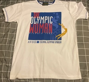 VINTAGE THE OLYMPIC WOMAN ATLANTA 1996 AVON PRODUCTS TAG TSHIRT MENS S/M SMALL - Picture 1 of 4