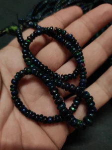 Black Ethiopian Opal Plain Rondelle Flashy Black Beads 4.5 to 6 Mm/16"Strand - Picture 1 of 6