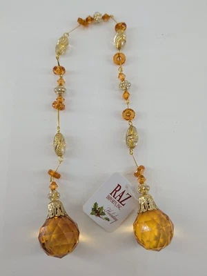 Cadena de adornos vintage RAZ Imports de plástico ámbar cristal con joyas 16,5" de largo Foto 1 de 4