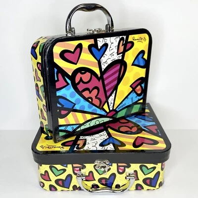 Juego de 2 cajas de cartón decorativas con asas Romero Britto para anidación Foto 1 de 4