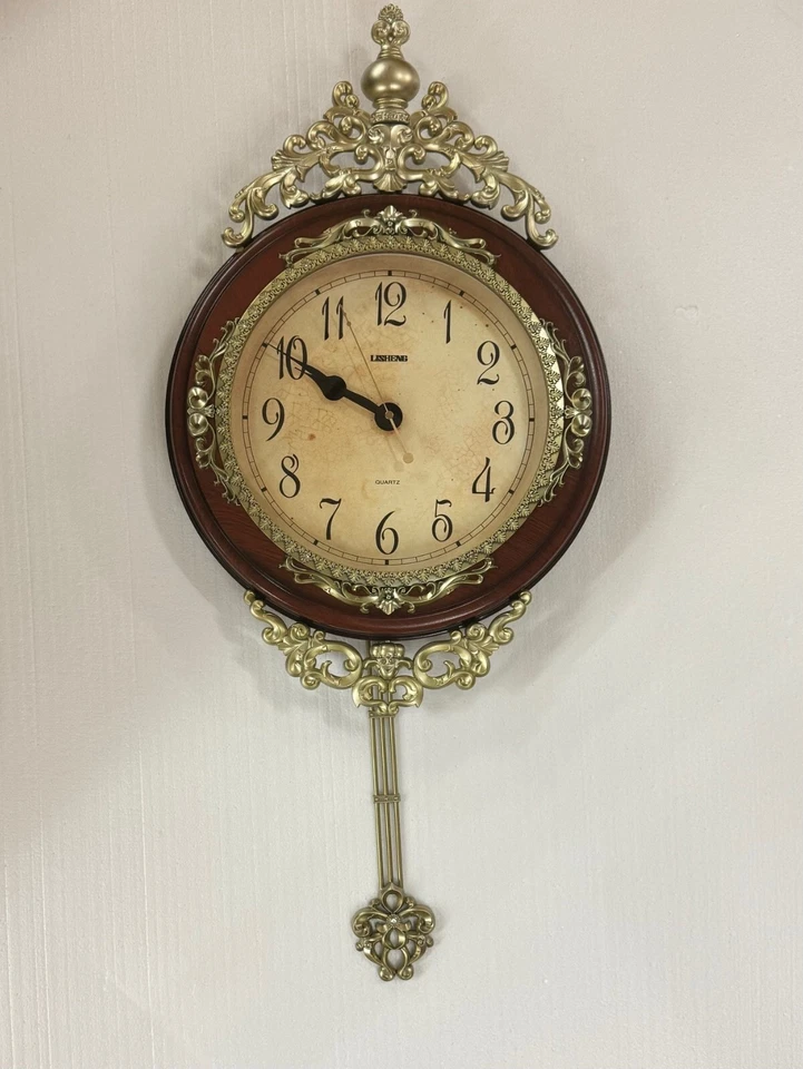 THREE STAR Wall Clock with Pendulum Brown and Gold 19" L x 21" W x 4" H - Image 1 of 1