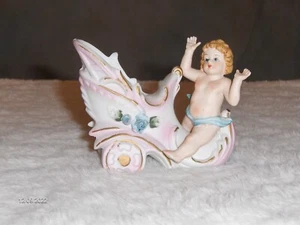 RARE VINTAGE BISQUE CHERUB RIDING ON A PINK SHOE PLANTER - Picture 1 of 2