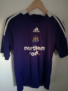 purple newcastle away kit