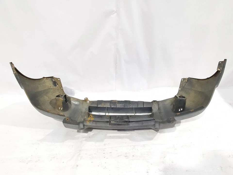 Parachoques delantero Nissan Frontier 2001 2002 2003 2004 OEM gris texturizado arañazos Foto 1 de 4