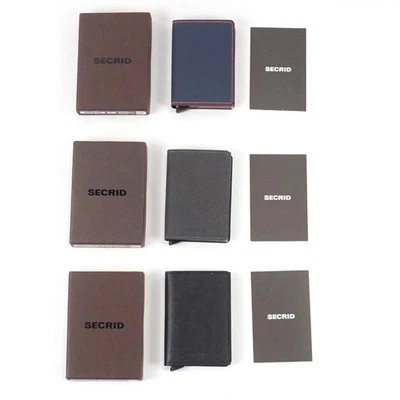 Lote de 3 billeteras Secrid Slim en azul noche mate y naranja/gris torcido/negro crujiente Foto 1 de 4
