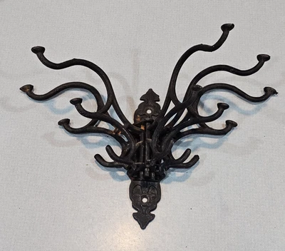 Gancho de pared giratorio grande de hierro fundido perchero monedero victoriano marrón oxidado Foto 1 de 4