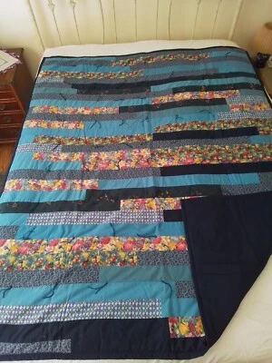 New Handmade Quilt 60" x 80" Blues w/ Flowers, Dark Blue Backing, can Reversive - Image 1 of 4