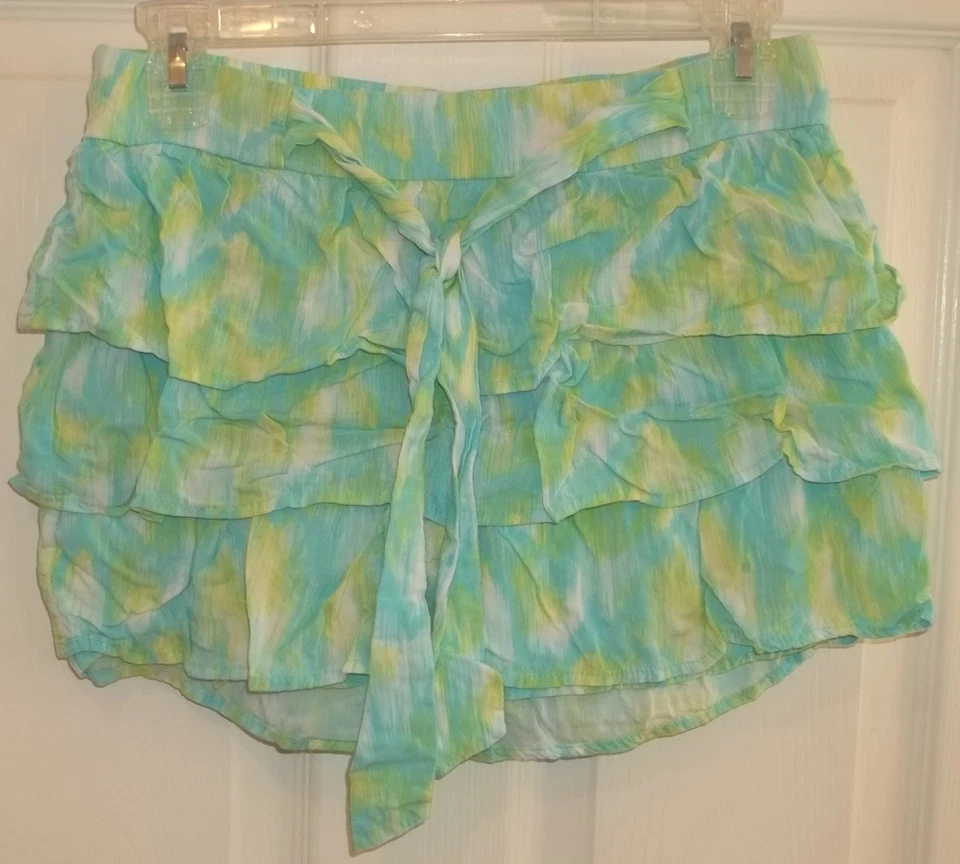 SKORT FEMININO DISNEY ASSINADO EM D~tamanho XL~saia NOVA~verde azul AQUA~camadas - Imagem 1 de 4