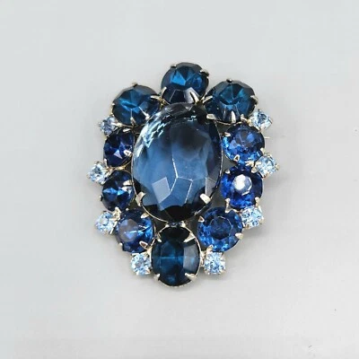 Unsigned Designer Shades of Blue Oval Glass Halo Rhinestone Silver Tone Brooch - Image 1 of 4