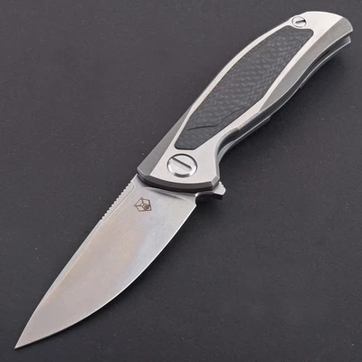 Navaja de bolsillo militar de combate con mango de titanio con incrustación de fibra de carbono con cojinete de aleta Foto 1 de 4