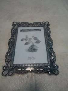 Metal & Rhinestone Filigree Rimed Desktop Photo Frame Frame: 6 ½” X 4 ¾” Holds 3 - Picture 1 of 3