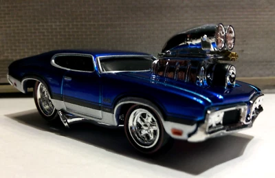 THE ORIGINAL MUSCLE MACHINES  1970 OLDS 442 1:64 DIECAST  70 OLDSMOBILE 442  - Image 1 of 4