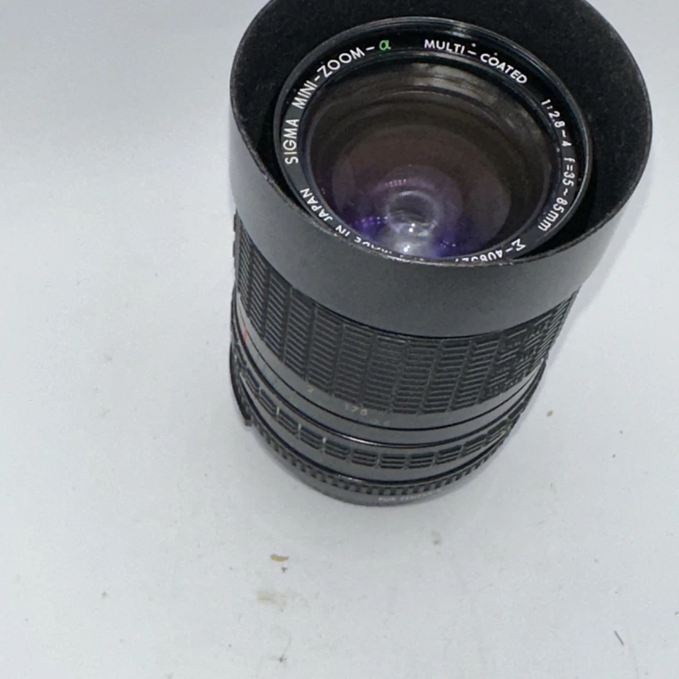 Lente multicapa Sigma Mini-Zoom 35-65 mm f/2,8-4 montaje Pentax-K probado funciona Foto 1 de 3