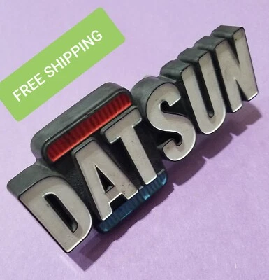 Bin20 used 72 1973 1974 1975 1976 1977 Datsun Bluebird grill emblem 62810-U2001 - Imagem 1 de 4