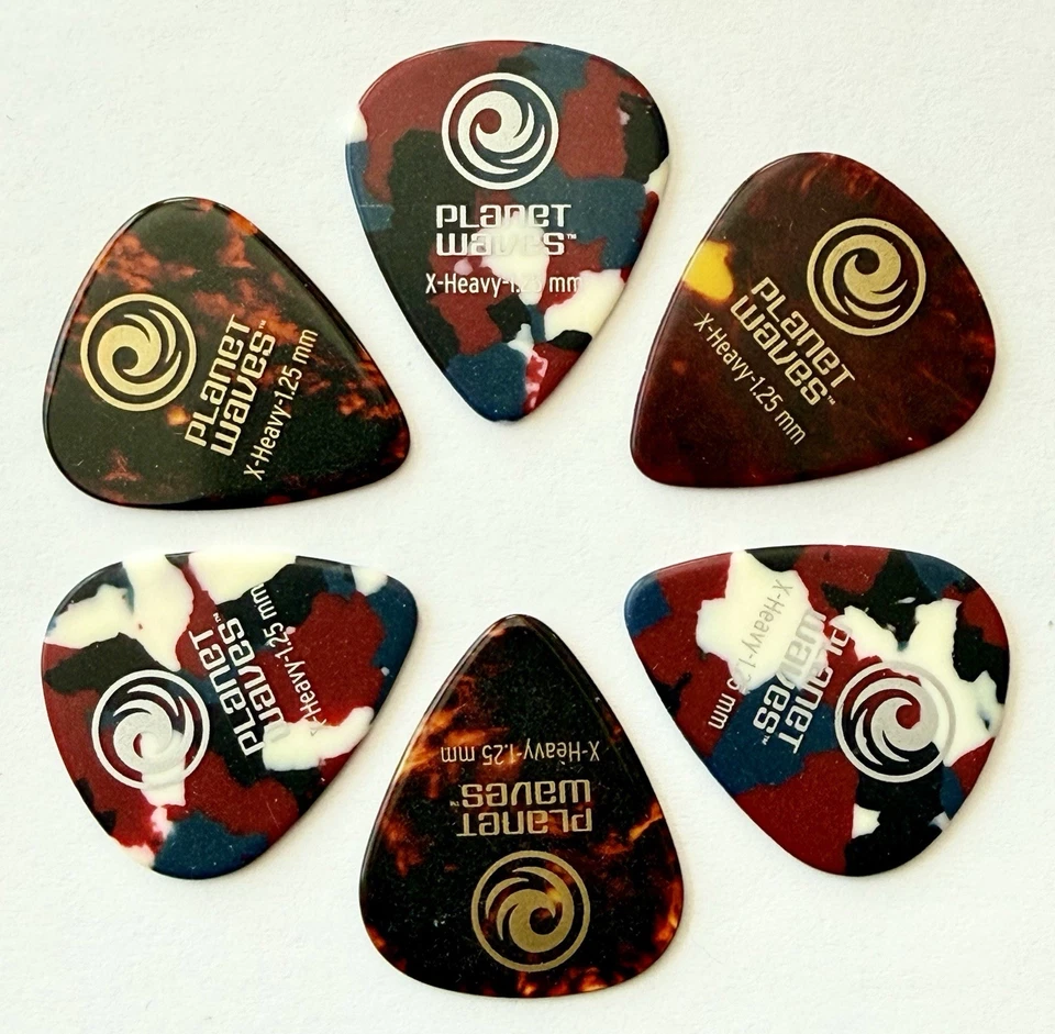 Paquete de 6 selecciones de guitarra Planet Waves surtidas de celuloide extra pesadas X pesadas 1,25 mm Foto 1 de 2