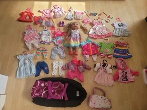 Baby Born Paket Konvolut Puppe Kleider Hosen Trage Roller - Bild 1 von 12
