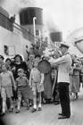 Steward 'gonging-off' visitors before 'Queen Mary' left Southampto - 1936 Photo