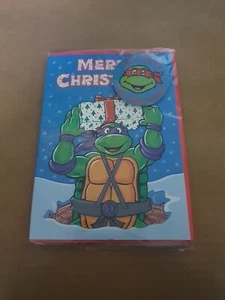 Tarjeta de Navidad 1990 TMNT con insignia Hey Guys Its Christmas (B25) - Imagen 1 de 3
