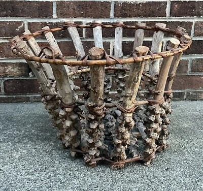 PRIMITIVE HANDMADE VINTAGE ROUND ADIRONDACK WOVEN GRAPEVINE TWIG STICK BASKET - Image 1 of 4